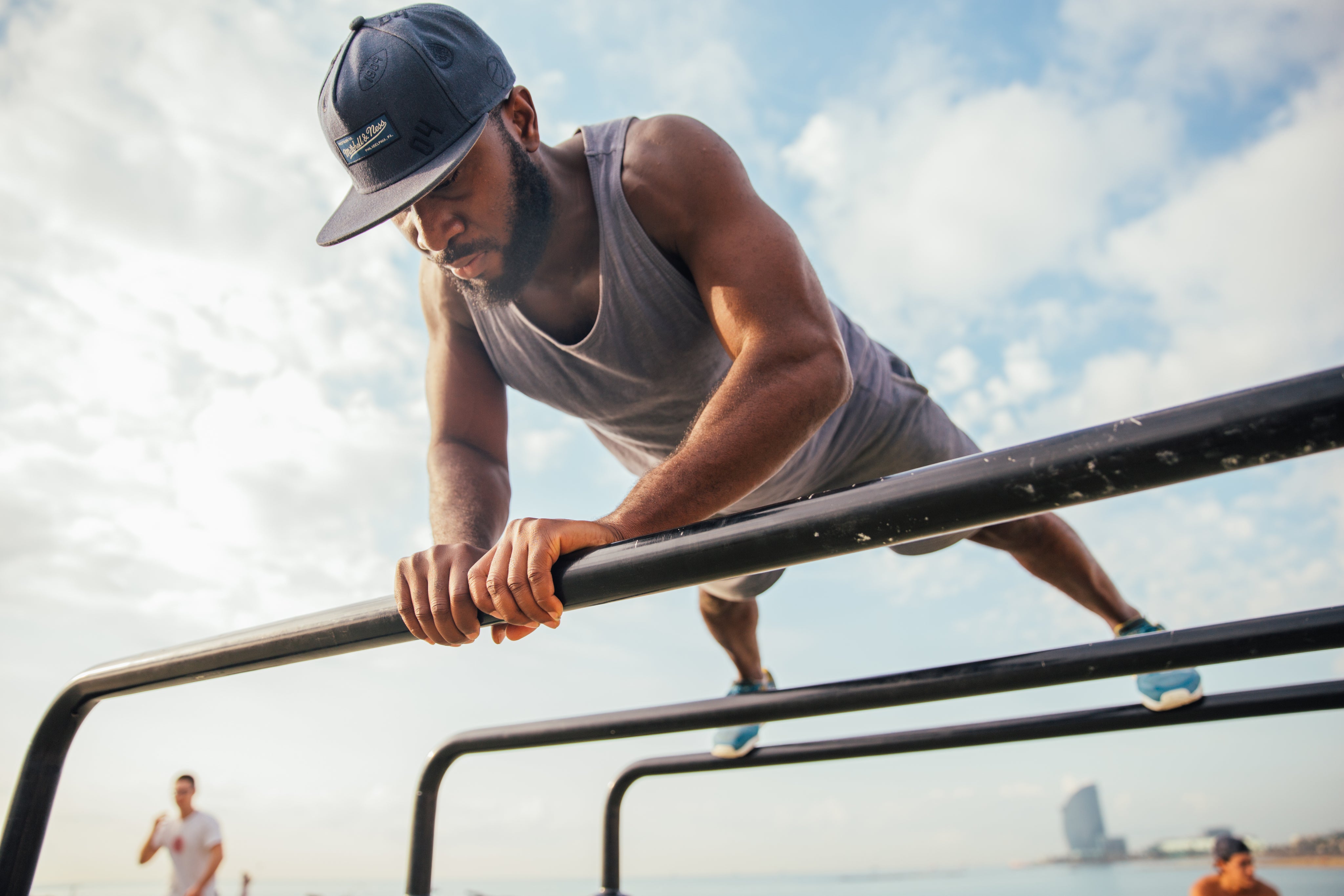 Man-Doing-Pushups-On-Bars.jpg